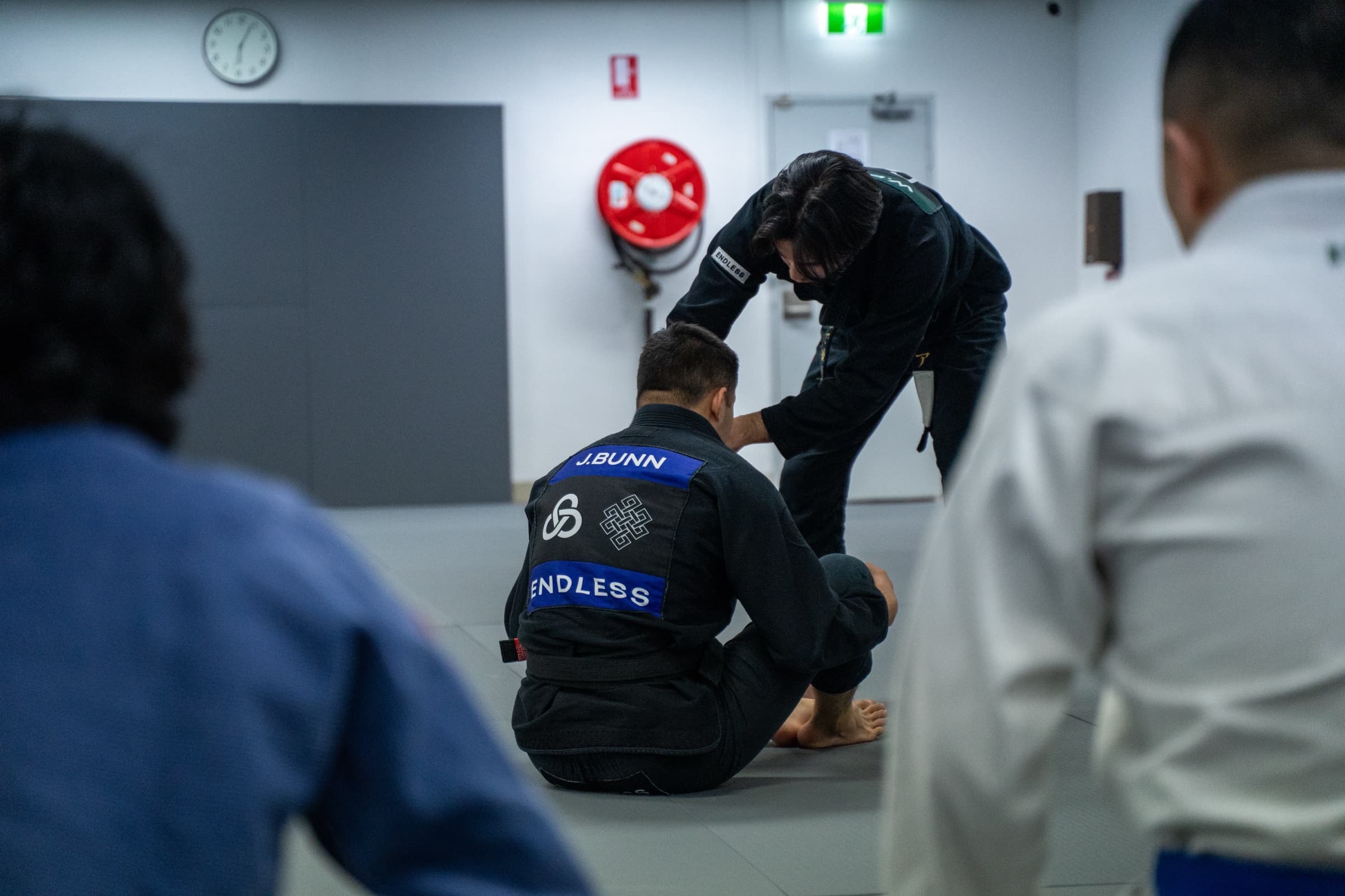 One of the earliest classes at Control Martial Arts, a coach adjusting a student's grip