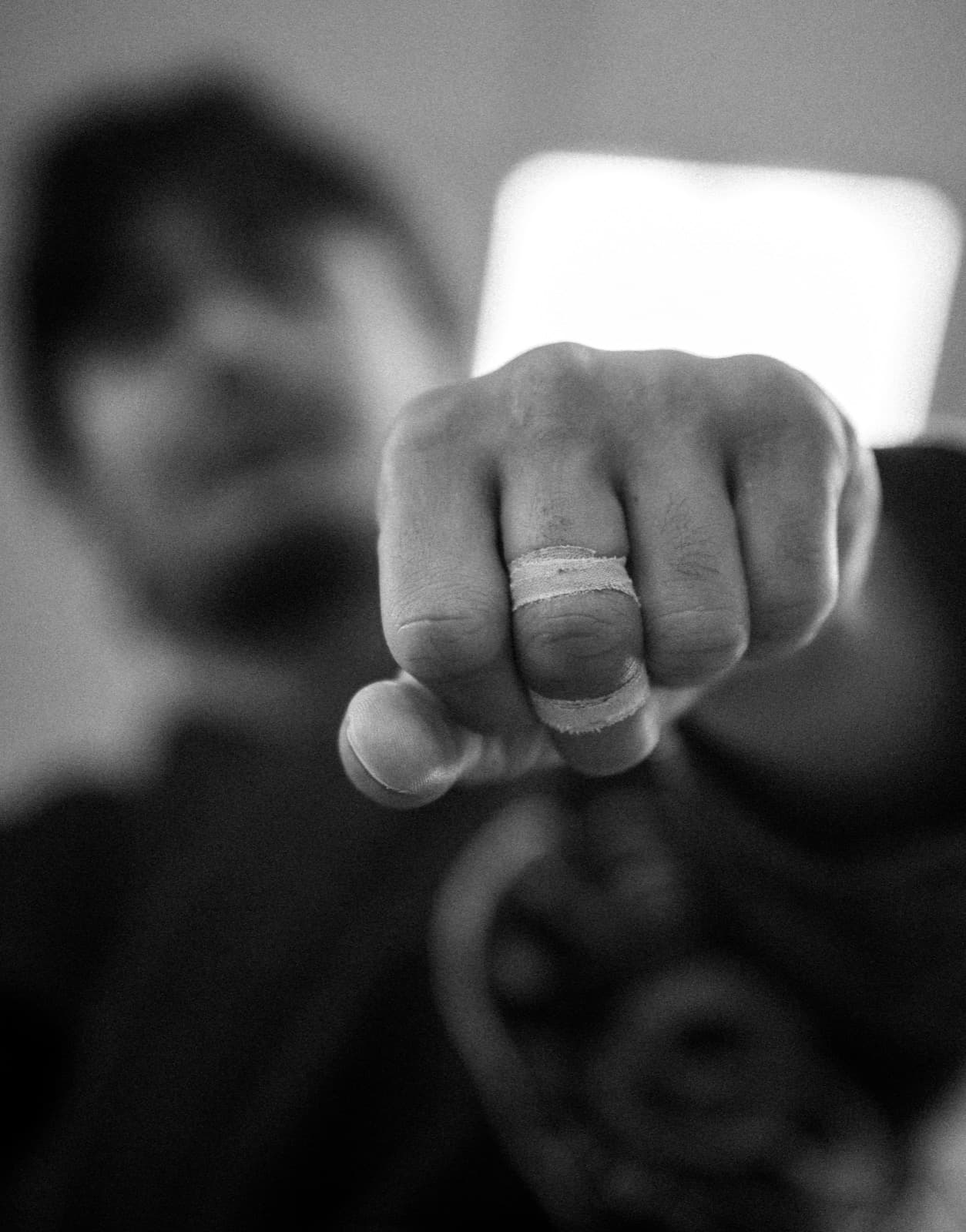 Finger tape, fist raised